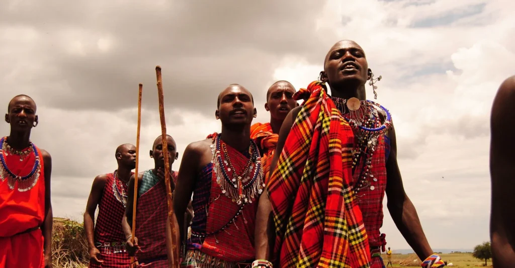 Maasai men in red shukas jumping